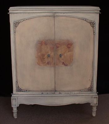 Ivory and peach French-style cabinet; 1920s.